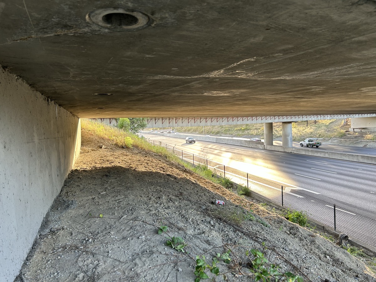 Under the overpass · engineered concrete above · freeway beside · soil sample site · East Bay CA · KenshoTek field dispatch · 925